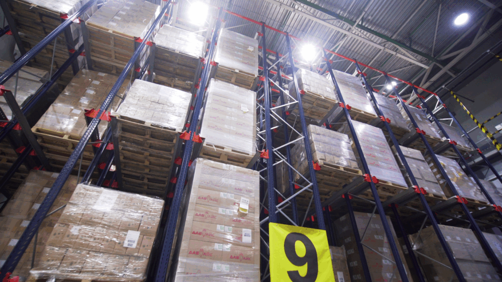 High-bay warehouse storage showing palletized inventory where real-time inventory visibility supports accurate forecasting