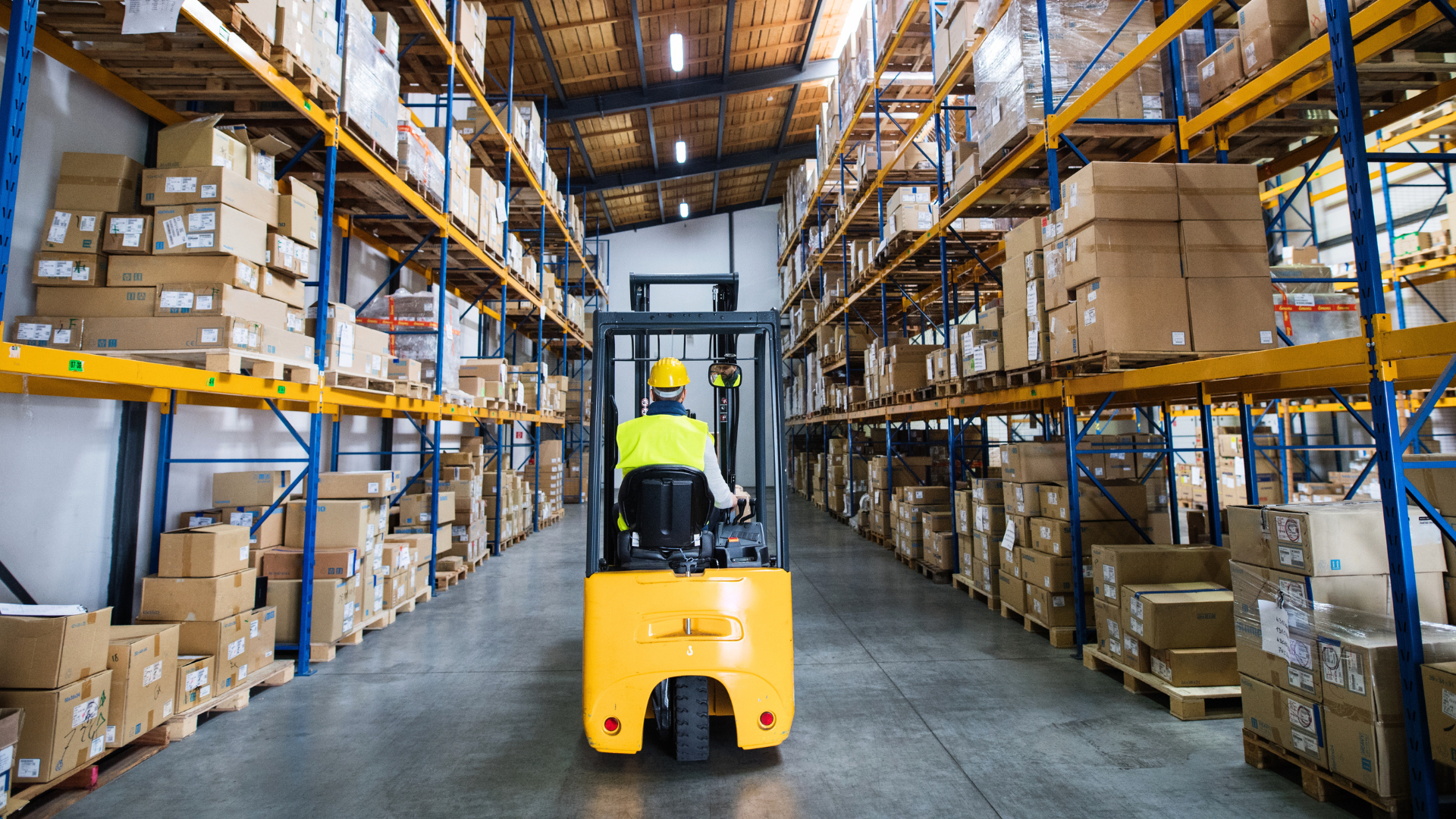 Warehouse associate on a forklift amid ongoing warehouse hiring challenges