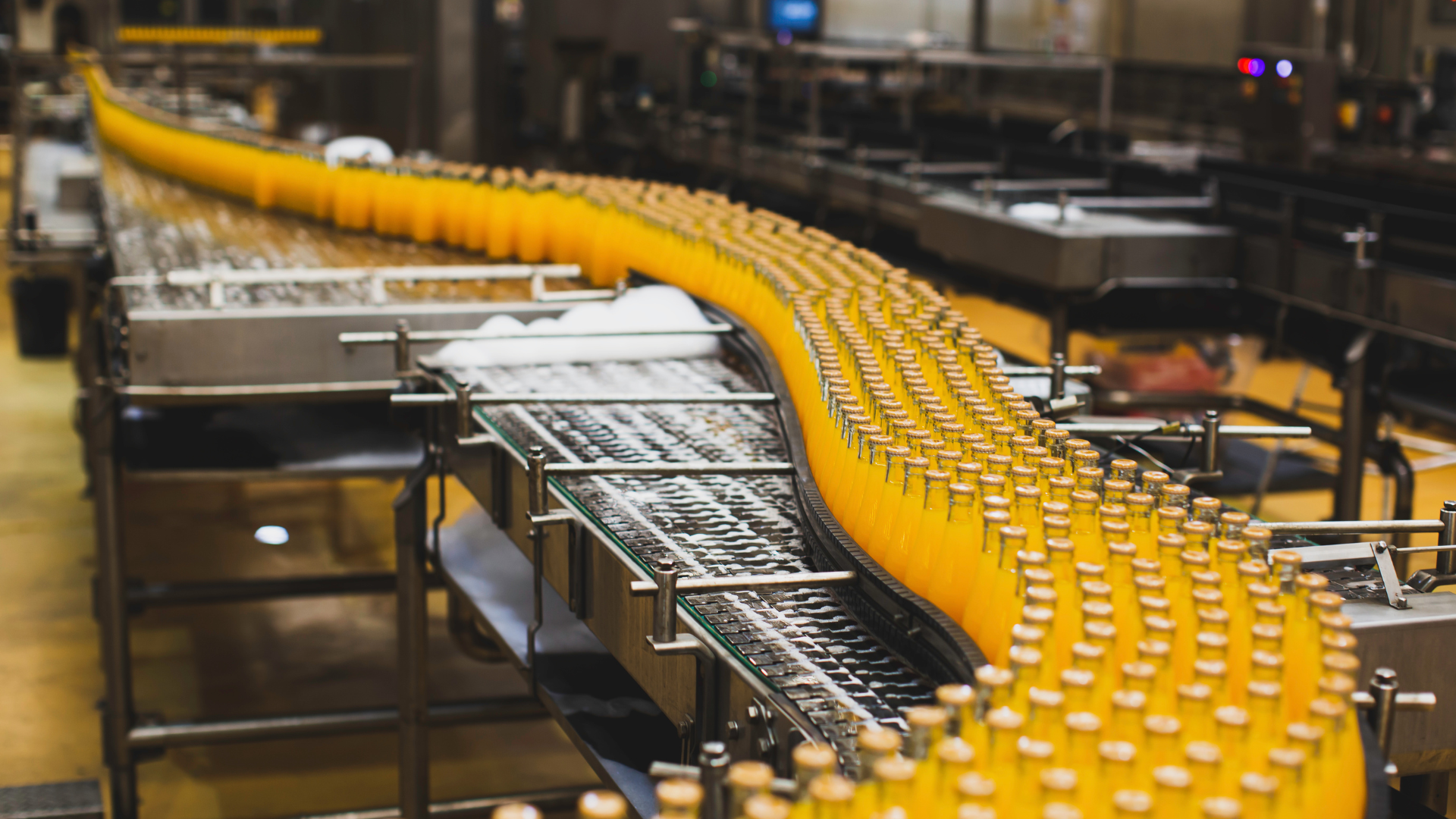 Juice bottling line showing the pace food and beverage warehouse labor teams manage during a shift.