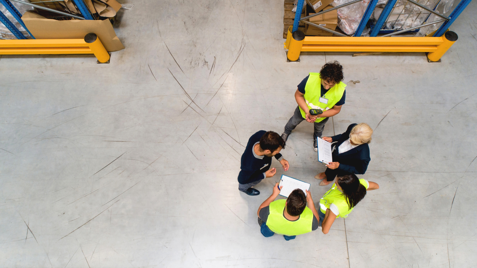 Warehouse team discussing warehouse performance during a floor huddle